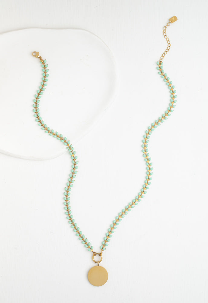 Seeds of Hope mint enamel leaf chain laid flat with lobster clasp and extender
