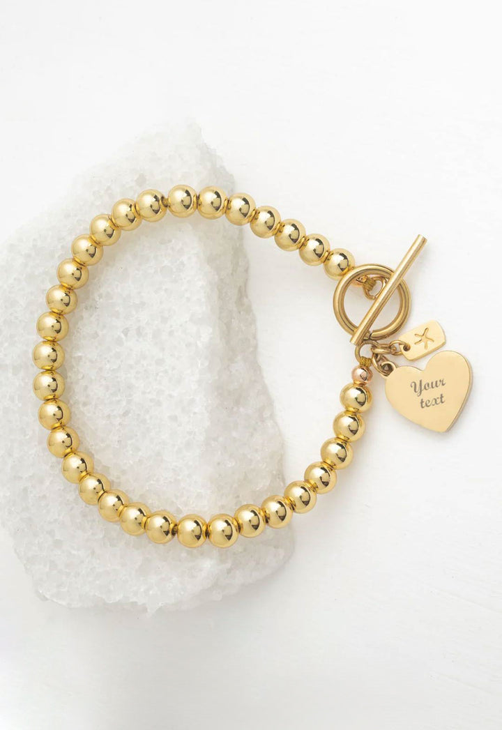 Engravable Heart Pendant on Handbeaded Gold Bracelet