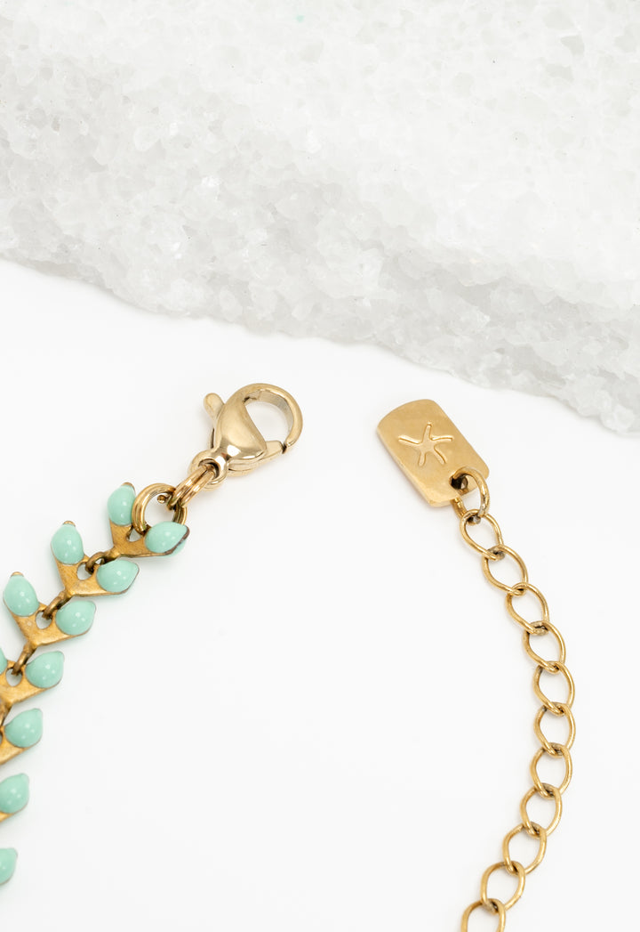 Close-up of mint Seeds of Hope chain lobster clasp and Starfish Project logo tag